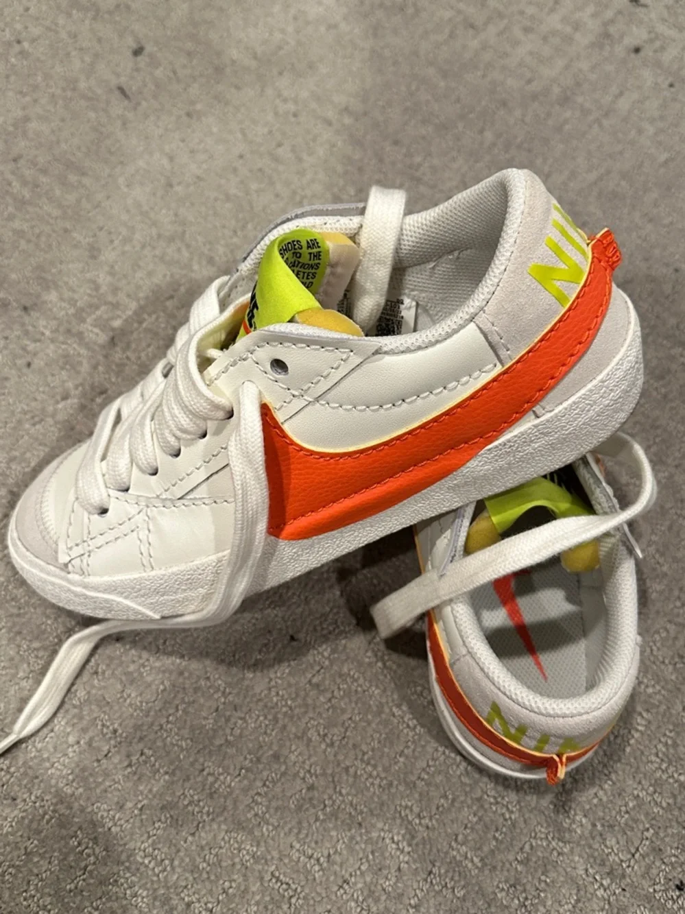 Nike White Sneakers with Neon Green Tongue and Orange Swoosh